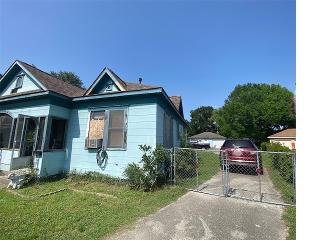 9910 Fulton St, Houston, TX 77076 - view of front of property featuring a gate, roof with shingles, and a sunroom