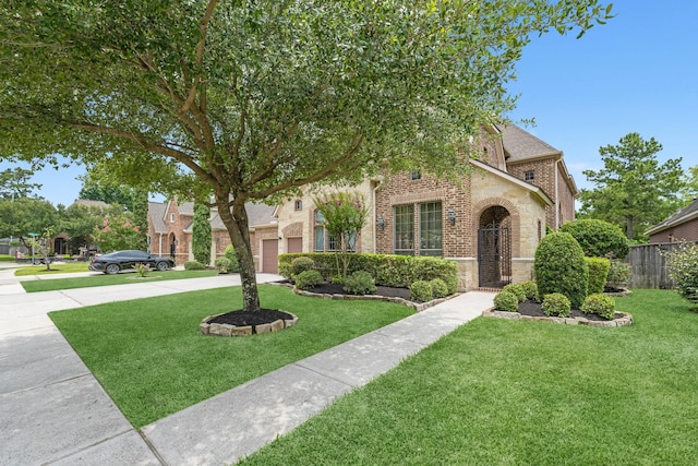 18630 Landrum Point Ln, Spring, TX 77388 - view of property hidden behind natural elements featuring driveway, brick siding, and stone siding