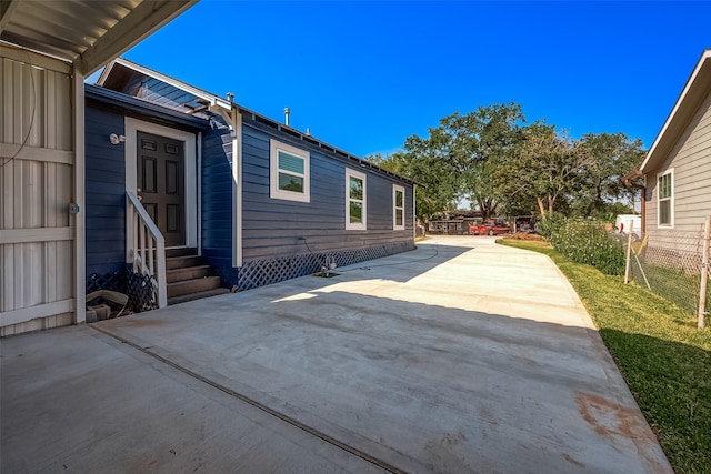 8302 Tavenor Ln, Houston, TX 77075 - view of patio / terrace featuring entry steps and concrete driveway