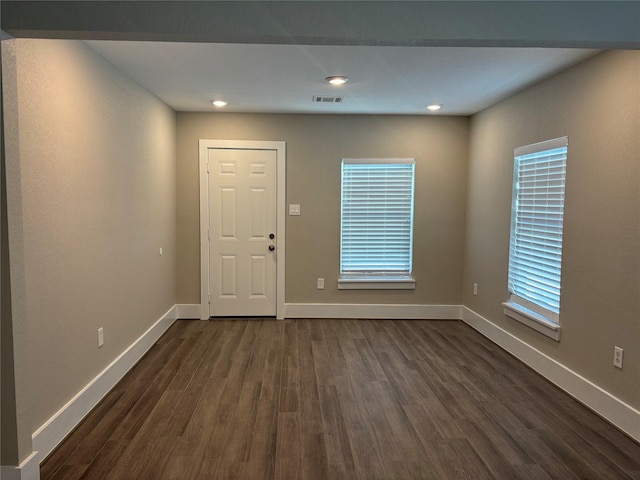 8302 Tavenor Ln, Houston, TX 77075 - entrance foyer with dark wood-type flooring, baseboards, and plenty of natural light