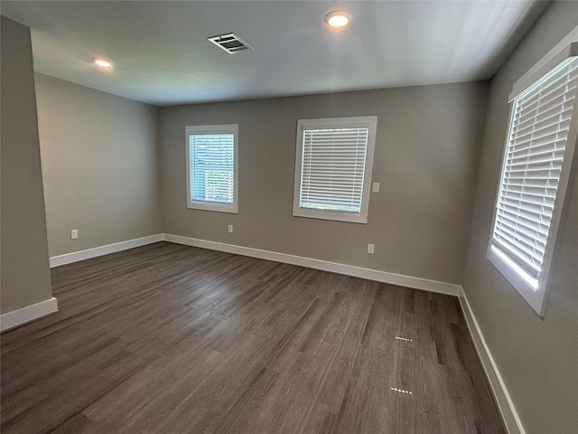 8302 Tavenor Ln, Houston, TX 77075 - unfurnished room featuring dark wood finished floors and baseboards
