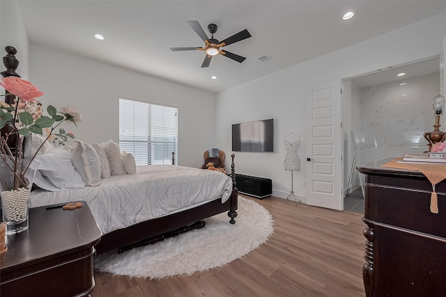 1305 E 27th St Unit A, Houston, TX 77009 - bedroom featuring wood finished floors, recessed lighting, baseboards, ceiling fan, and connected bathroom