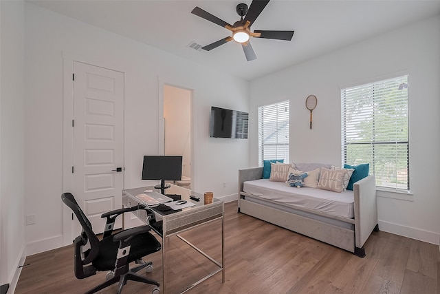 1305 E 27th St Unit A, Houston, TX 77009 - home office featuring ceiling fan, baseboards, and wood finished floors