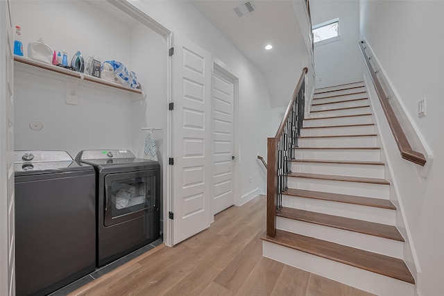 1305 E 27th St Unit A, Houston, TX 77009 - washroom with washer and dryer and light wood-type flooring