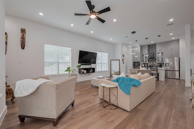 1305 E 27th St Unit A, Houston, TX 77009 - living area with a ceiling fan, light wood-style flooring, and recessed lighting