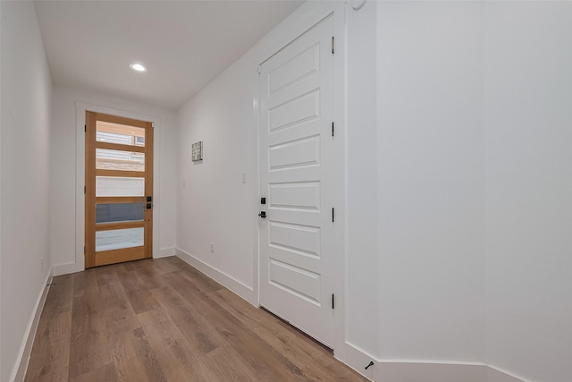 1305 E 27th St Unit A, Houston, TX 77009 - doorway to outside with wood finished floors, baseboards, and recessed lighting