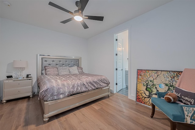 1305 E 27th St Unit A, Houston, TX 77009 - bedroom featuring wood finished floors, ensuite bath, ceiling fan, and baseboards