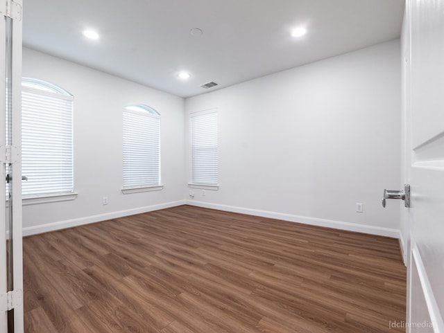 1224 Thompson, Houston, TX 77007 - empty room with dark wood finished floors, recessed lighting, and baseboards