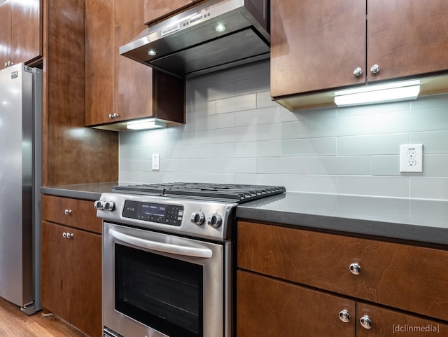 1224 Thompson, Houston, TX 77007 - kitchen with appliances with stainless steel finishes, range hood, dark countertops, and backsplash