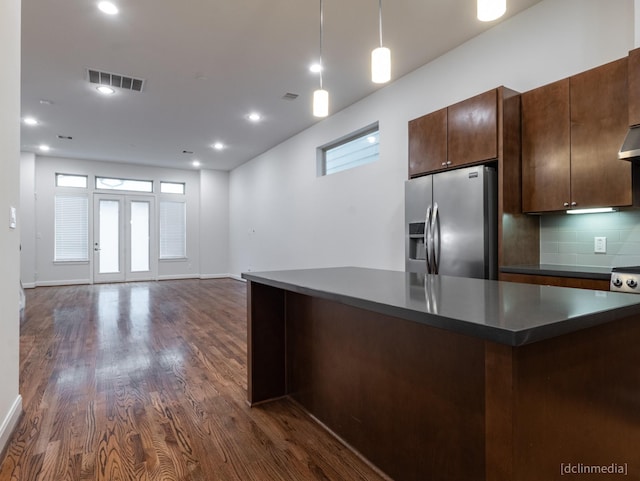 1224 Thompson, Houston, TX 77007 - kitchen featuring stainless steel fridge with ice dispenser, dark countertops, dark wood-type flooring, backsplash, and open floor plan