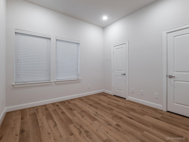 1224 Thompson, Houston, TX 77007 - spare room with light wood-type flooring, baseboards, and recessed lighting