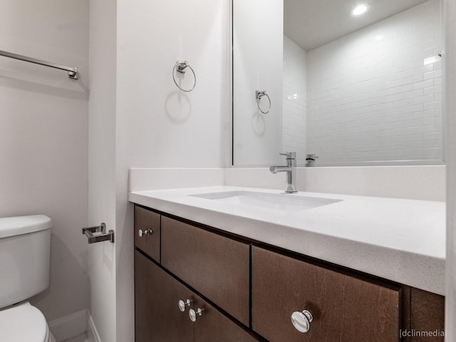 1224 Thompson, Houston, TX 77007 - bathroom with toilet, vanity, baseboards, and recessed lighting
