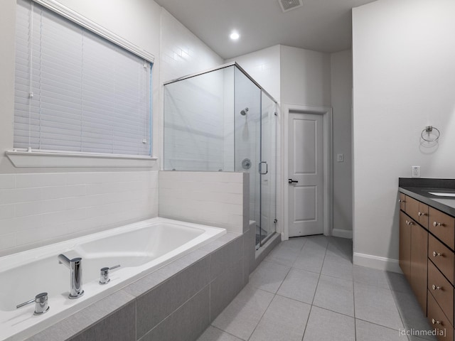 1224 Thompson, Houston, TX 77007 - bathroom with a bath, vanity, a stall shower, tile patterned flooring, and baseboards