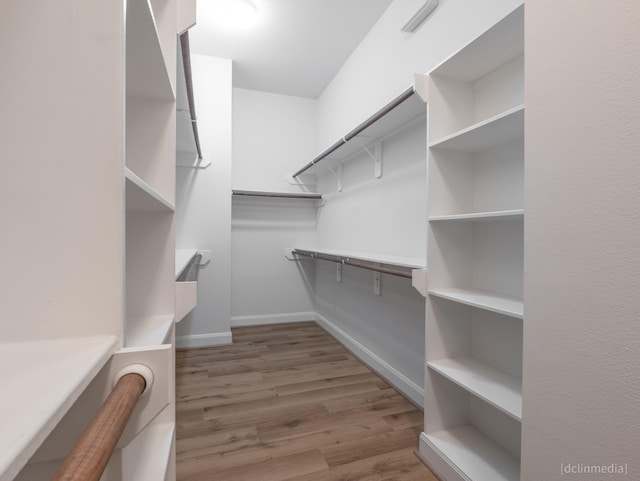 1224 Thompson, Houston, TX 77007 - spacious closet featuring wood finished floors
