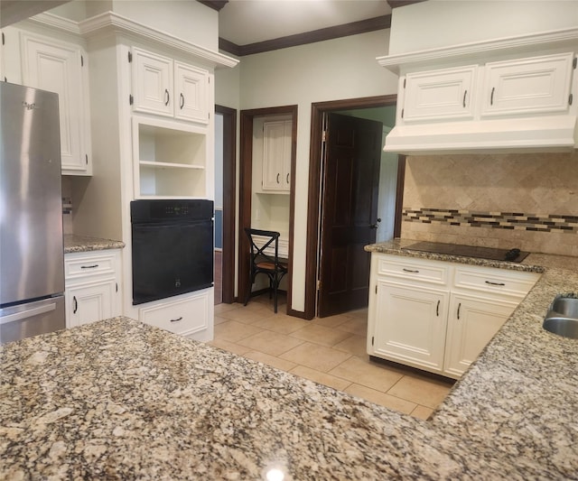 15903 Ridge Park Dr, Houston, TX 77095 - kitchen with black appliances, light tile patterned floors, light stone countertops, backsplash, and ornamental molding