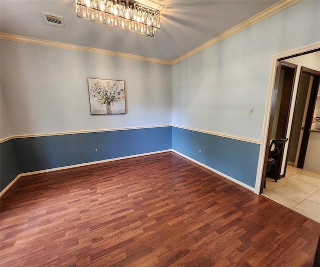 15903 Ridge Park Dr, Houston, TX 77095 - unfurnished room with wood finished floors, crown molding, baseboards, and a chandelier