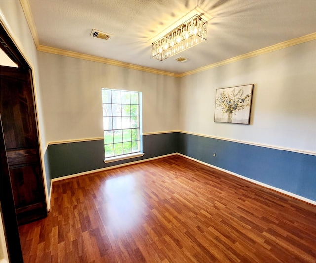 15903 Ridge Park Dr, Houston, TX 77095 - unfurnished room featuring wood finished floors, ornamental molding, baseboards, and a chandelier