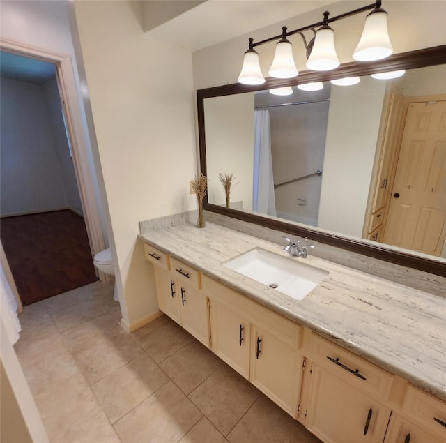 15903 Ridge Park Dr, Houston, TX 77095 - full bath with toilet, vanity, tile patterned flooring, and baseboards