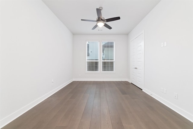11023 White Caterpillar Dr, Cypress, TX 77433 - unfurnished room with ceiling fan, baseboards, and dark wood-type flooring