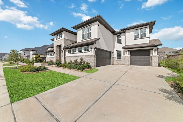 11023 White Caterpillar Dr, Cypress, TX 77433 - prairie-style home featuring an attached garage, driveway, stucco siding, a front yard, and stone siding