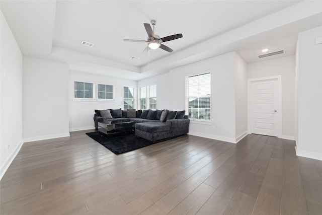 11023 White Caterpillar Dr, Cypress, TX 77433 - living room featuring a ceiling fan, baseboards, a raised ceiling, dark wood-style flooring, and recessed lighting