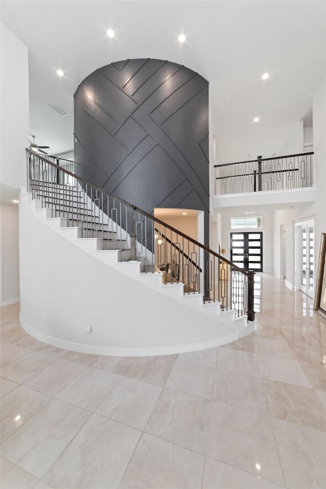 11023 White Caterpillar Dr, Cypress, TX 77433 - stairway featuring a towering ceiling, recessed lighting, and baseboards