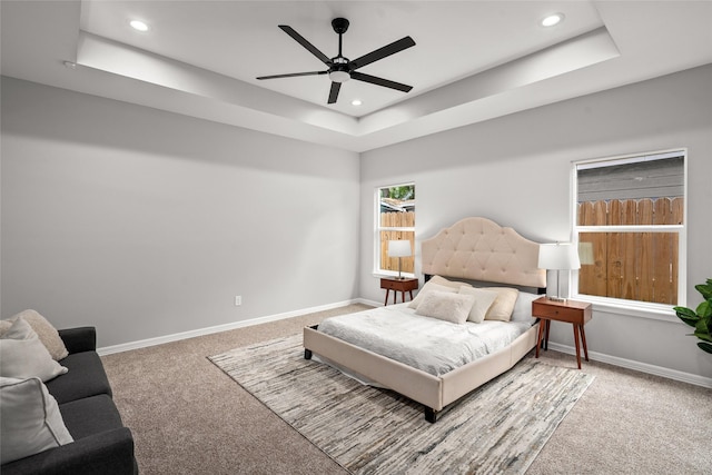 14307 Laredo St, Houston, TX 77015 - carpeted bedroom with a tray ceiling, recessed lighting, and ceiling fan