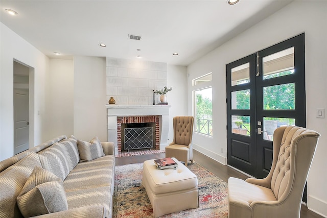 4002 Old Chocolate Bayou Rd Unit Cr89, Manvel, TX 77578 - living area with dark wood-style floors, recessed lighting, a brick fireplace, and baseboards