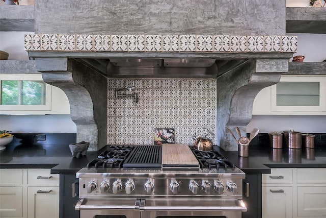 4002 Old Chocolate Bayou Rd Unit Cr89, Manvel, TX 77578 - kitchen featuring stainless steel range, dark countertops, white cabinetry, and tasteful backsplash