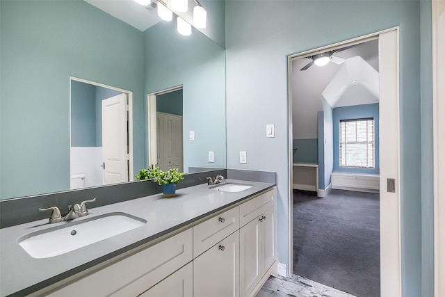 4002 Old Chocolate Bayou Rd Unit Cr89, Manvel, TX 77578 - full bathroom featuring a ceiling fan, toilet, double vanity, baseboards, and marble look tiles