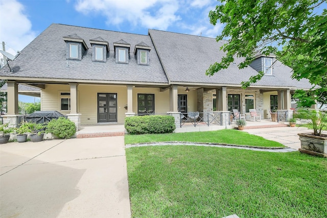 4002 Old Chocolate Bayou Rd Unit Cr89, Manvel, TX 77578 - view of front of home featuring a porch, a front yard, a shingled roof, and stone siding
