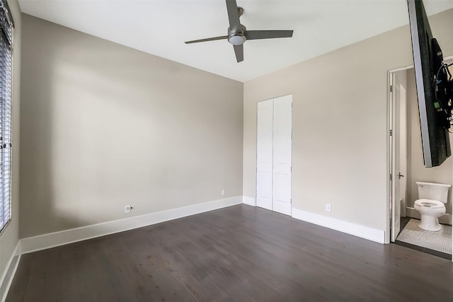 4002 Old Chocolate Bayou Rd Unit Cr89, Manvel, TX 77578 - unfurnished bedroom featuring dark wood finished floors, baseboards, a closet, ensuite bath, and a ceiling fan