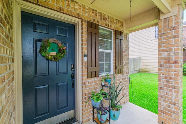 4719 Redbud Place Ln, Richmond, TX 77469 - property entrance with a porch and brick siding