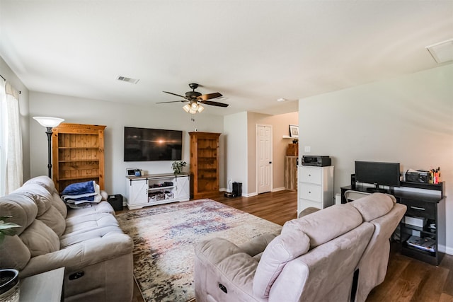 4719 Redbud Place Ln, Richmond, TX 77469 - living room featuring dark wood-style flooring, a ceiling fan, and baseboards