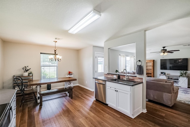 4719 Redbud Place Ln, Richmond, TX 77469 - kitchen featuring a sink, stainless steel dishwasher, dark countertops, and dark wood-type flooring