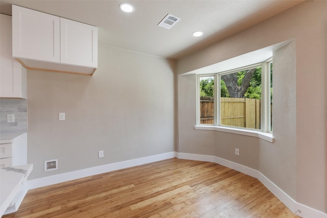 12406 Whittington Dr, Houston, TX 77077 - empty room featuring light wood-type flooring, baseboards, and recessed lighting