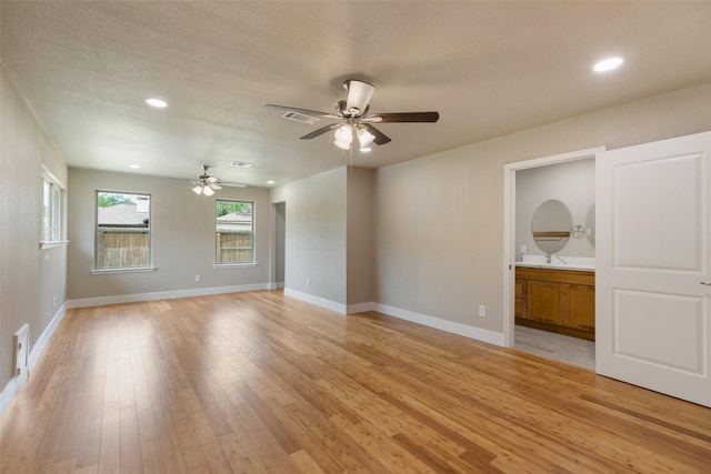 12406 Whittington Dr, Houston, TX 77077 - spare room featuring ceiling fan, light wood finished floors, baseboards, and recessed lighting