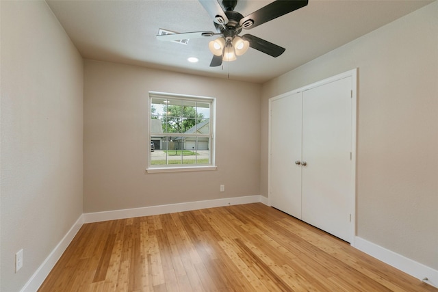 12406 Whittington Dr, Houston, TX 77077 - unfurnished bedroom featuring light wood finished floors, baseboards, a closet, and ceiling fan