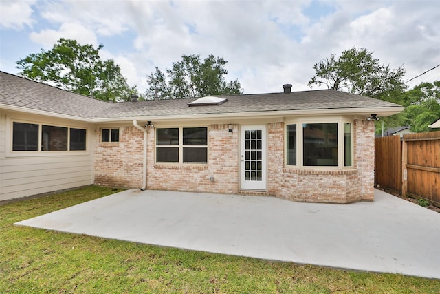 12406 Whittington Dr, Houston, TX 77077 - rear view of property featuring brick siding, a patio, and a shingled roof