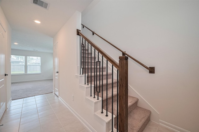 12327 Buck Sable Ln, Houston, TX 77044 - stairway with tile patterned floors, carpet floors, and recessed lighting