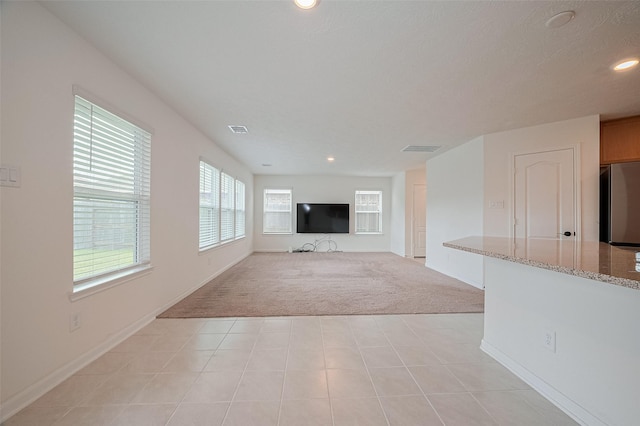 12327 Buck Sable Ln, Houston, TX 77044 - unfurnished living room featuring light colored carpet and recessed lighting