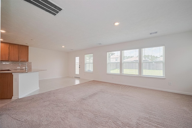 12327 Buck Sable Ln, Houston, TX 77044 - unfurnished living room with recessed lighting and light carpet