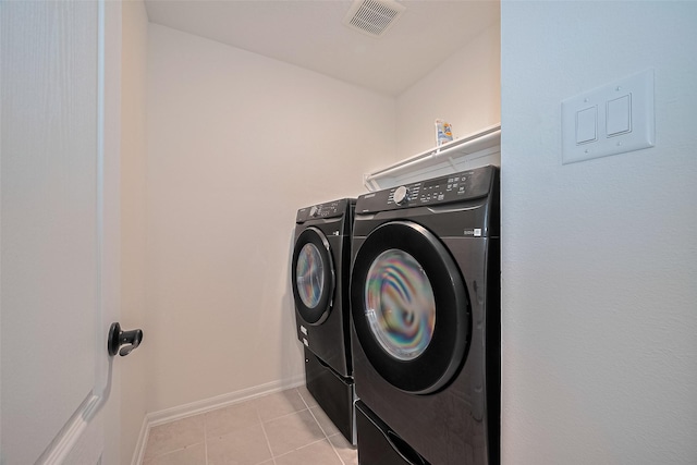 12327 Buck Sable Ln, Houston, TX 77044 - laundry area featuring separate washer and dryer and light tile patterned floors