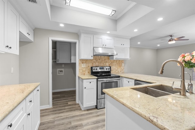 161 Litchfield Ln, Houston, TX 77024 - kitchen with electric range, ventilation hood, recessed lighting, light wood-type flooring, and light stone counters