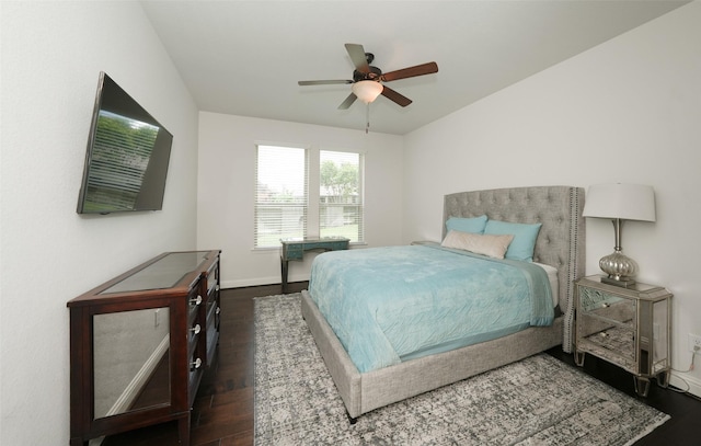 21015 Arden Park Dr, Richmond, TX 77407 - bedroom with dark wood-style flooring, baseboards, and a ceiling fan