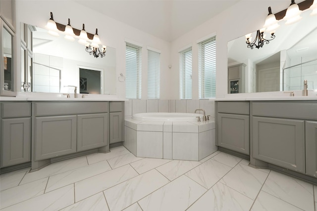 21015 Arden Park Dr, Richmond, TX 77407 - bathroom with a chandelier, two vanities, and a bath