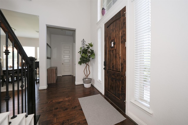 21015 Arden Park Dr, Richmond, TX 77407 - foyer featuring dark wood finished floors, stairway, and baseboards