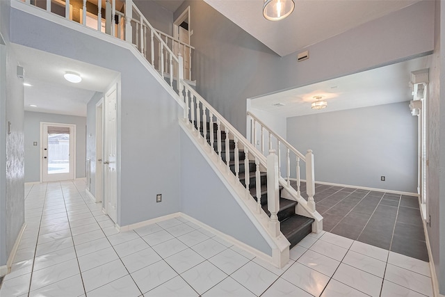 3718 Sweetgum Hill Ln, Houston, TX 77345 - stairs featuring tile patterned flooring and baseboards