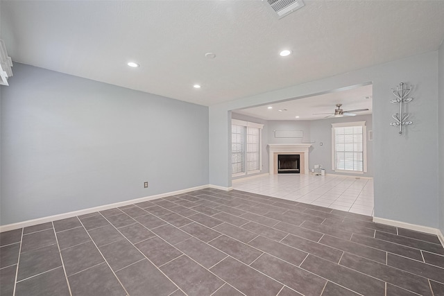 3718 Sweetgum Hill Ln, Houston, TX 77345 - unfurnished living room with a ceiling fan, tile patterned flooring, recessed lighting, a fireplace, and baseboards