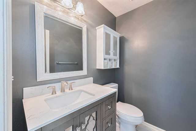 3718 Sweetgum Hill Ln, Houston, TX 77345 - half bathroom with toilet, vanity, and baseboards